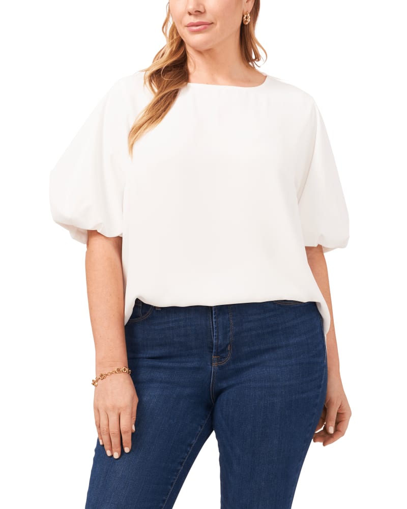 Front of a model wearing a size 1X Luxe Puff Sleeve Blouse in New Ivory by Vince Camuto. | dia_product_style_image_id:261168
